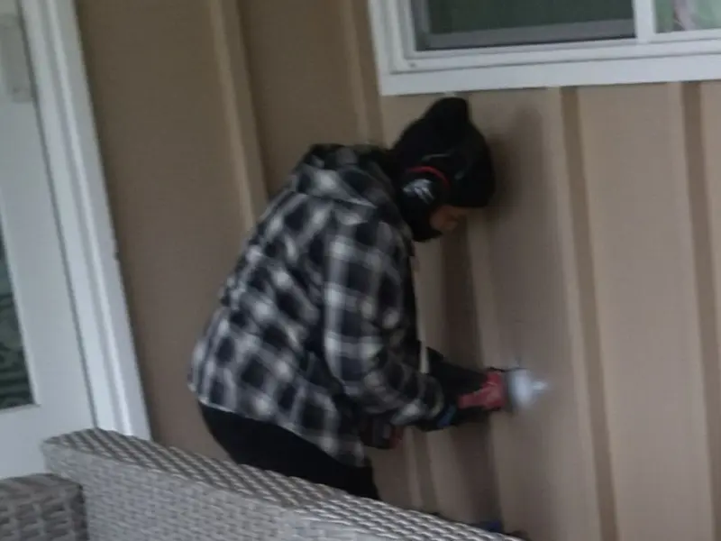Professional electrician installing an exterior outlet in Brea