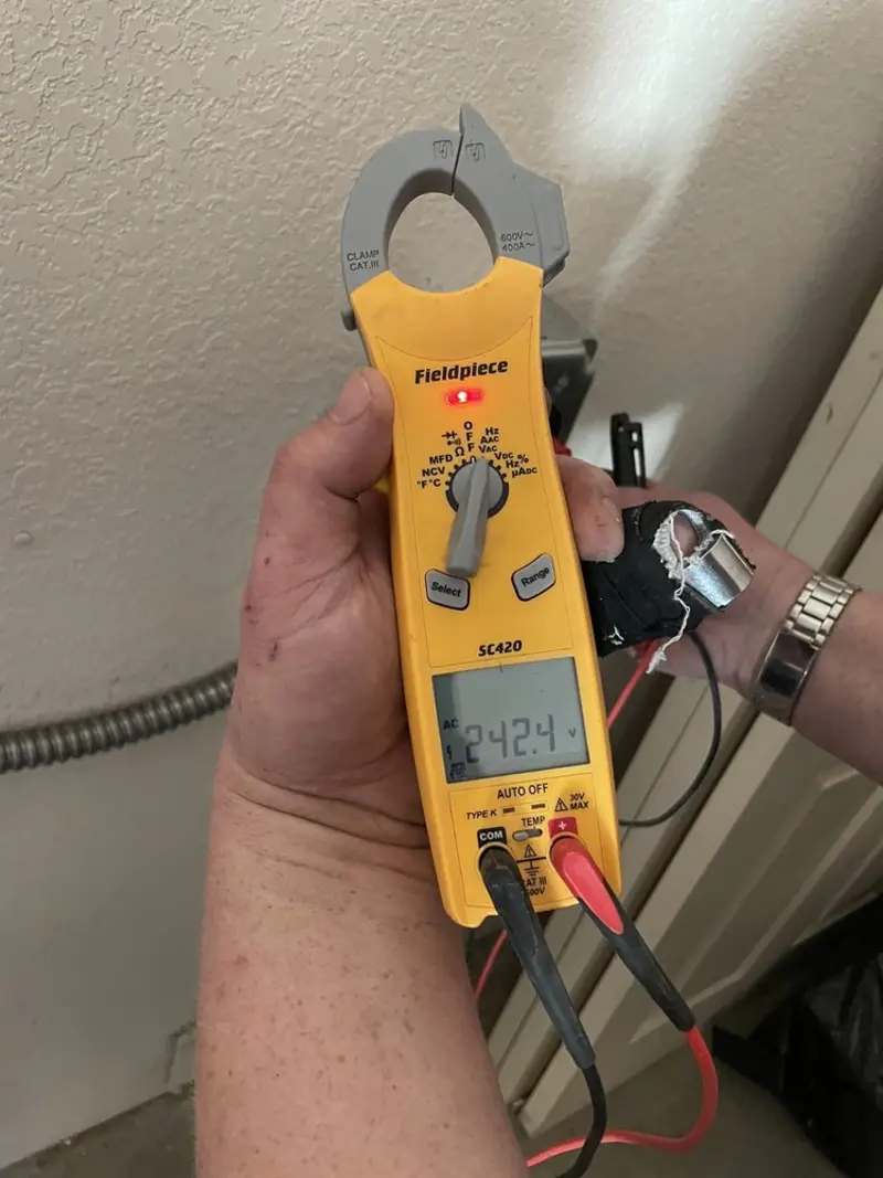 Voltage testing with clamp meter during Ceiling Fan Installation in Brea